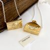 Love letter locket in yellow gold when opened reveals a secret letter