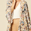 Shorter style cape with frill sleeves
