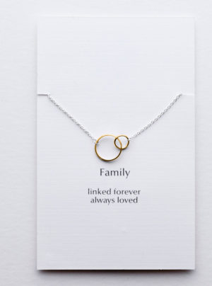 linked circles in yellow gold on a sterling silver chain
