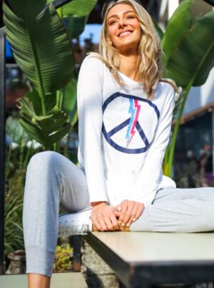 Long sleeve white tee with a peace symbol and lightning bolt