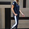 Navy track pants with a white panel and navy star at the ankle