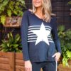 Navy long sleeve top with white stripes across the front and a large star