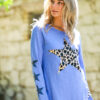 long sleeve tee with leopard star on the front and 3 small stars on the right sleeve