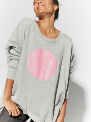 Grey kit with pink sequin circle on the font