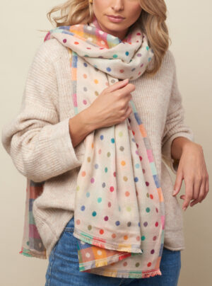 cream scarf with colourful dots on one side and checks on the other