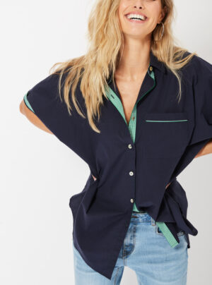 Short sleeve navy blue shirt with contast green trim