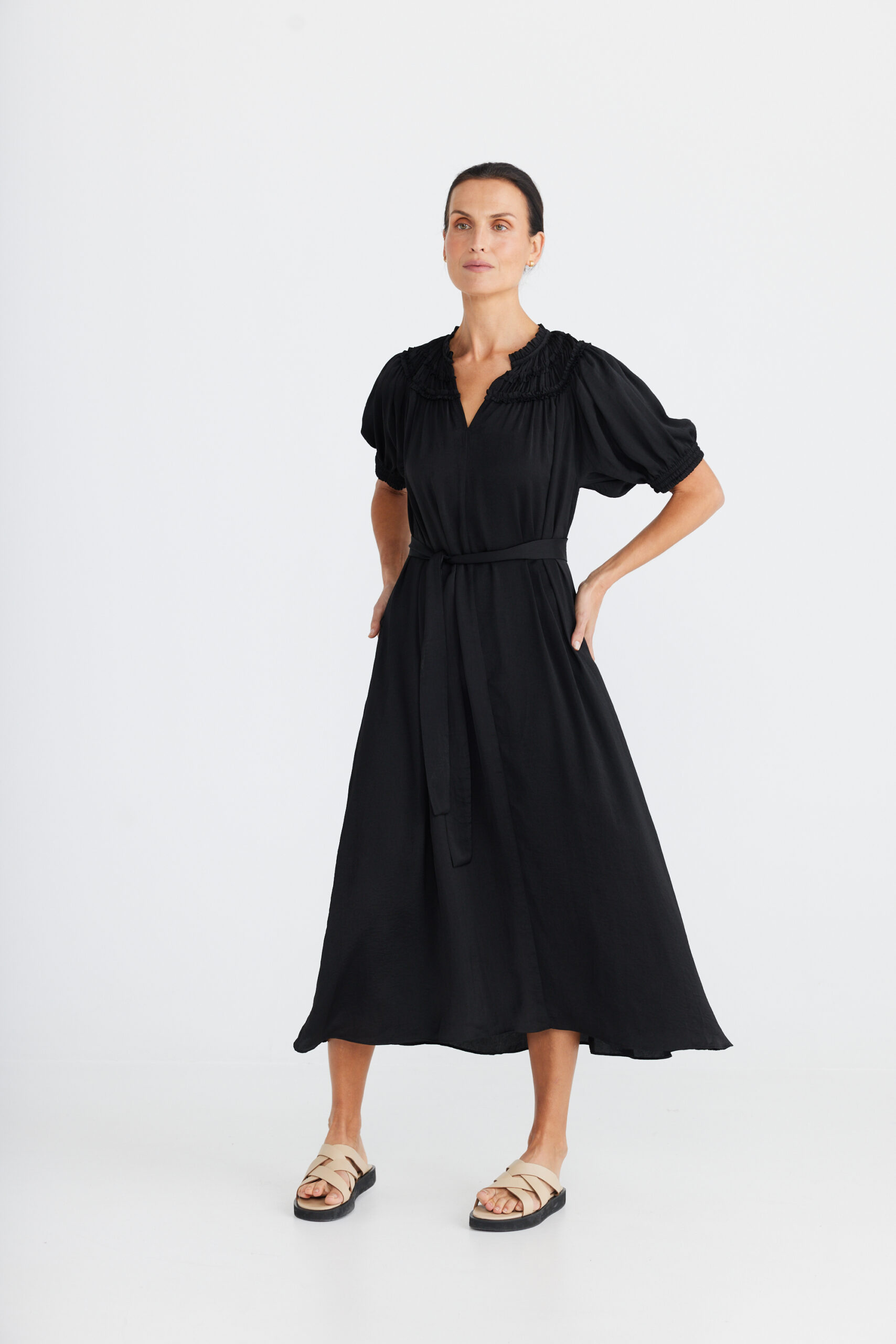 Mid length black dress with frill detail neckline