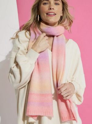 Girl wearing a winter scarf in pinks and oranges