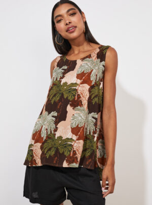 girl wearing a tank top with palm print in greens