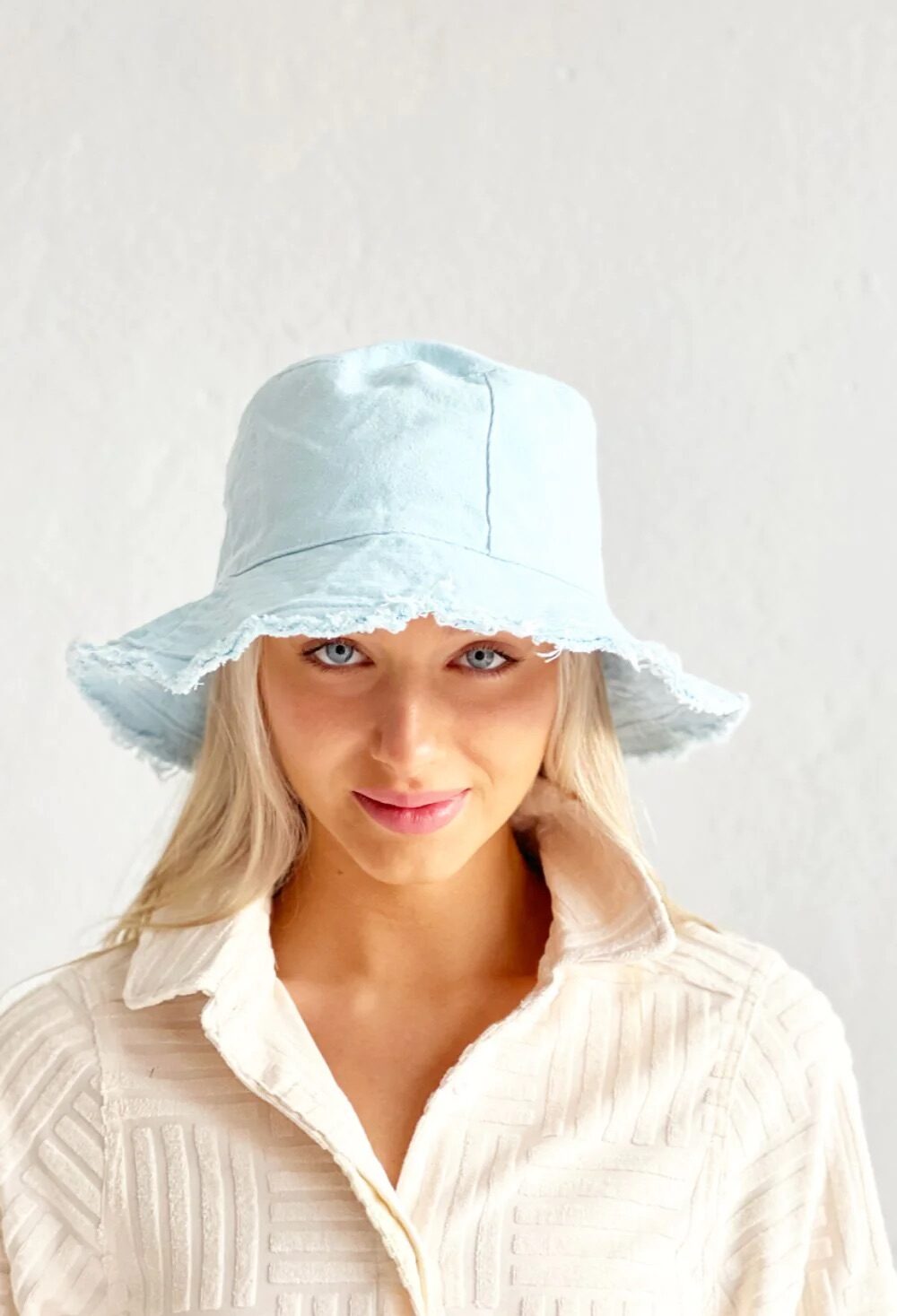 Blue cotton canvas hat with frayed edge